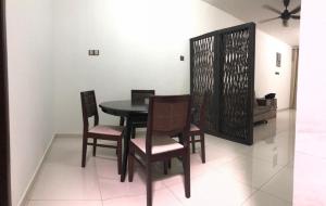 a dining room with a table and chairs at Modern 3 bedrooms House, Walking distance to Kulim Town by Mr Homestay in Kulim