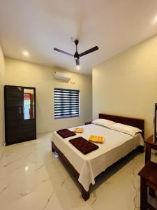 a bedroom with a bed and a ceiling fan at Munroe Meadows home in Munroe Island
