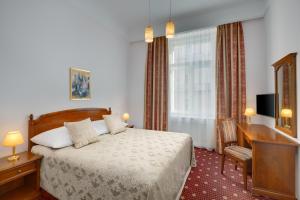 Postel nebo postele na pokoji v ubytování Boutique Hotel Seven Days