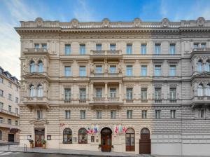 a large building in front of a street at Boutique Hotel Seven Days in Prague