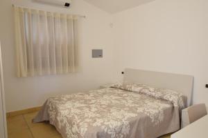 Katil atau katil-katil dalam bilik di Luisa Apartment