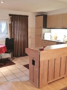 a kitchen with a counter top in a room at Waldesruh Strausberg in Strausberg
