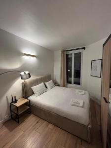 Кровать или кровати в номере Charmant appartement proche Paris et Stade de France !