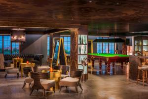 a bar with a pool table and a billiard room at Le Meridien Mahabaleshwar Resort & Spa in Mahabaleshwar