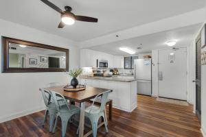 a kitchen and dining room with a table and chairs at SunDestin 416 in Destin