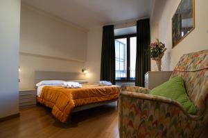 A bed or beds in a room at Le Cupoline