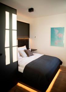 Ein Bett oder Betten in einem Zimmer der Unterkunft YokoLou - Design-Apartments