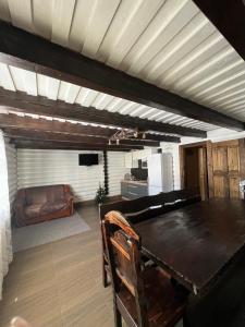 a living room with a wooden table and a couch at Holiday home shale in Bukovel