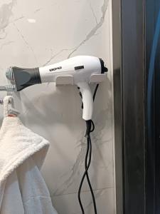 a hair dryer is attached to a wall at Tevosyan EVN Airport in Pʼarakʼar