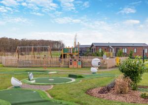 a park with a playground with a play equipment at Angrove Country Park in Stokesley