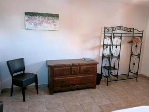 a room with a desk and a chair and a shelf at Õ 2040 Chambre Sapin in Saint-Véran