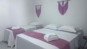 Cama ou camas em um quarto em Pousada Estrelar