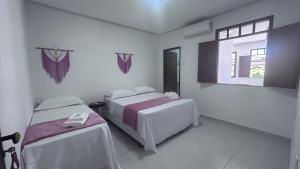 Cama ou camas em um quarto em Pousada Estrelar mais 37 fotos