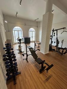 a gym with several treadmills and machines in a room at Hotel Uirapuru in Araraquara