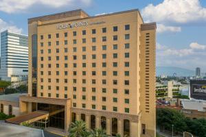 a hotel building with a sign on top of it at Four Points by Sheraton Galerias Monterrey in Monterrey