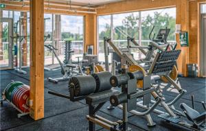 a gym with a bunch of exercise equipment in it at Stunning Apartment In Stjrnhov With House Sea View in Stjärnhov