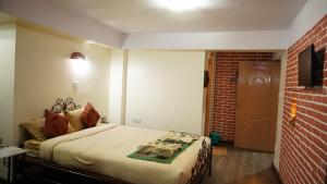 Sjónvarps- og/eða afþreyingartæki á Cosy Hotel
