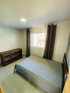 En eller flere senge i et værelse på Casa Família Morada da plataforma