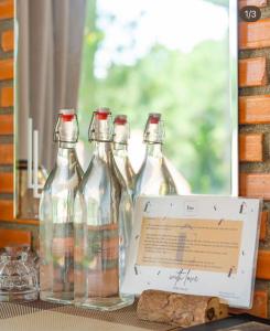 a group of glass bottles sitting on a table at Scent Room - Village in Da Lat