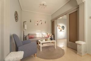 a living room with a couch and a table at Elvira's houses in Agria