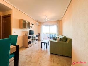 a living room with a couch and a table at Relax y Naturaleza in Oropesa del Mar