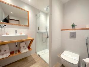 a bathroom with a sink toilet and a shower at Chaume de Balveurche in Xonrupt-Longemer +119 photos