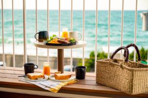 a table with a plate of food and a basket at KAMOME SLOW HOTEL the COMPACT in Awaji