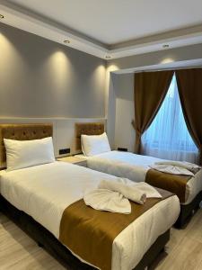 Postel nebo postele na pokoji v ubytování Sareban Hotel Istanbul