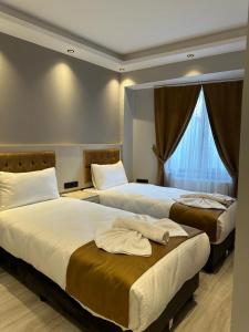 Postel nebo postele na pokoji v ubytování Sareban Hotel Istanbul