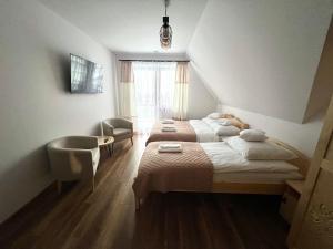 Postel nebo postele na pokoji v ubytování Rozeta