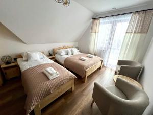 Postel nebo postele na pokoji v ubytování Rozeta