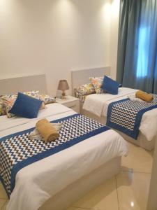 A bed or beds in a room at Sharm Hills