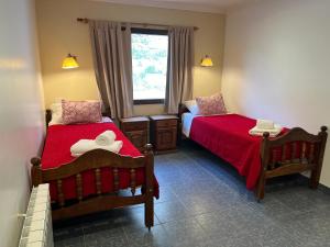 Un pat sau paturi într-o cameră la Hosteria Koonek