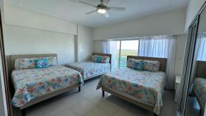 Postel nebo postele na pokoji v ubytování Blue Boat Lindo Apartamento en Playa Juan Dolio