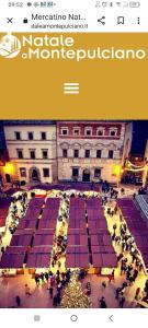 une affiche d'un bâtiment avec un groupe de personnes dans l'établissement Appartamento Panoramico, à Montepulciano