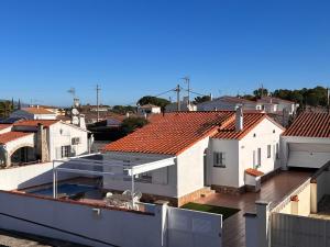 arial view of a house with red roof at Villa OM, Piscina Privada, Aire Acondicionado Free in L'Escala