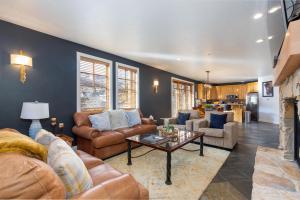 a living room with a couch and a table at Town Pointe A105 in Park City