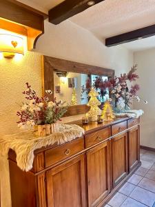 a bathroom with a vanity with a large mirror at Hotel Stella Del Nord in Courmayeur