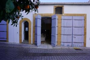 an entrance to a building with white and yellow doors at Large Kamara Studio in Nicosia