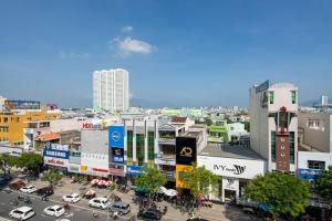 an overhead view of a city with cars on a street at Lotus Rock Hotel Đà Nẵng in Da Nang