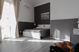A bed or beds in a room at DUCEZIO rooms