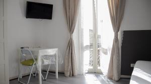 TV a/nebo společenská místnost v ubytování DUCEZIO rooms