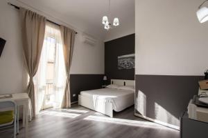 Postel nebo postele na pokoji v ubytování DUCEZIO rooms