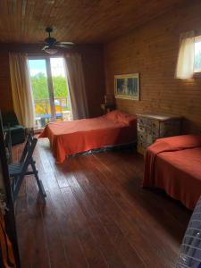 Cama o camas de una habitación en Las Alquimillas apart -a 70 metros de la playa-