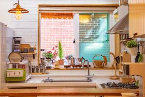 a kitchen with a sink and a window at I'm Green Stay in Seoul