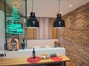 a dining room with a christmas tree on the wall at ladadikathess in Thessaloniki