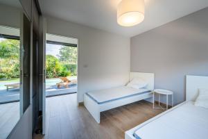 Ένα ή περισσότερα κρεβάτια σε δωμάτιο στο Villa Alicia +27 φωτογραφίες