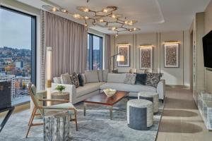 a living room with a couch and a table at The Ritz-Carlton, Portland in Portland