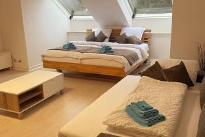 a bedroom with a large bed and a couch at Appartement im Bielefelder Westen in Bielefeld