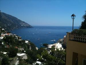 a view of the ocean from a city at Hotel Posa Posa in Positano